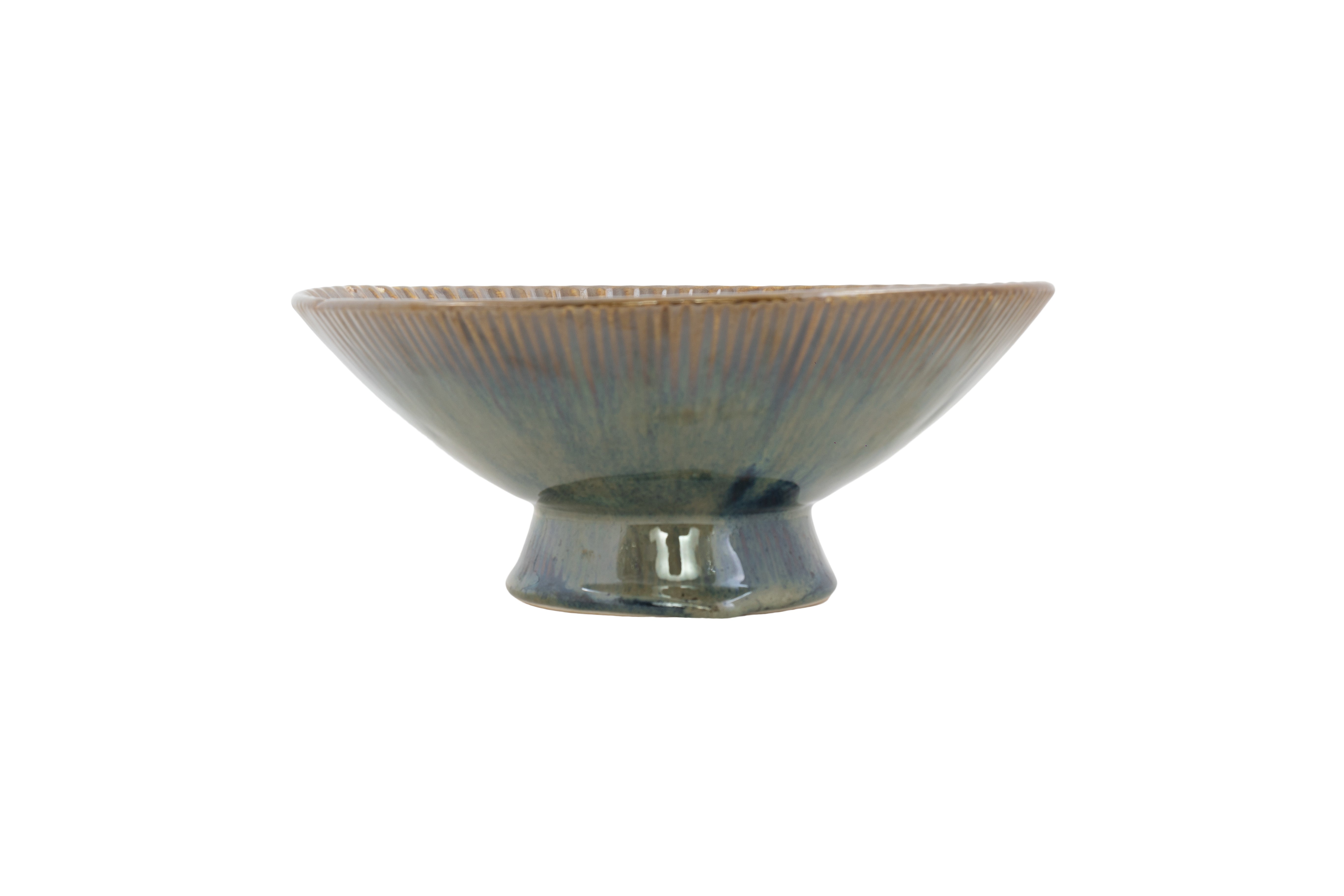 Ceramic bowl with ribbed texture on a white background